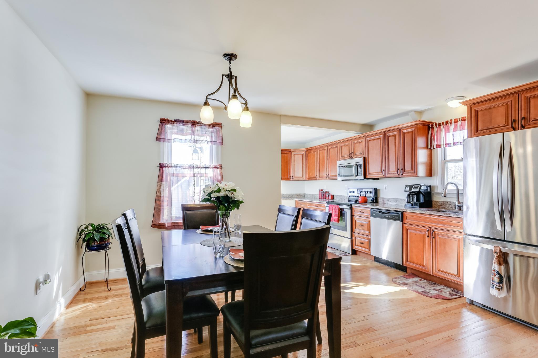 1809 Briarcliff Road Baltimore, MD 21234 - Photo 5 of 33 a view of a dining room with furniture window and wooden floor
