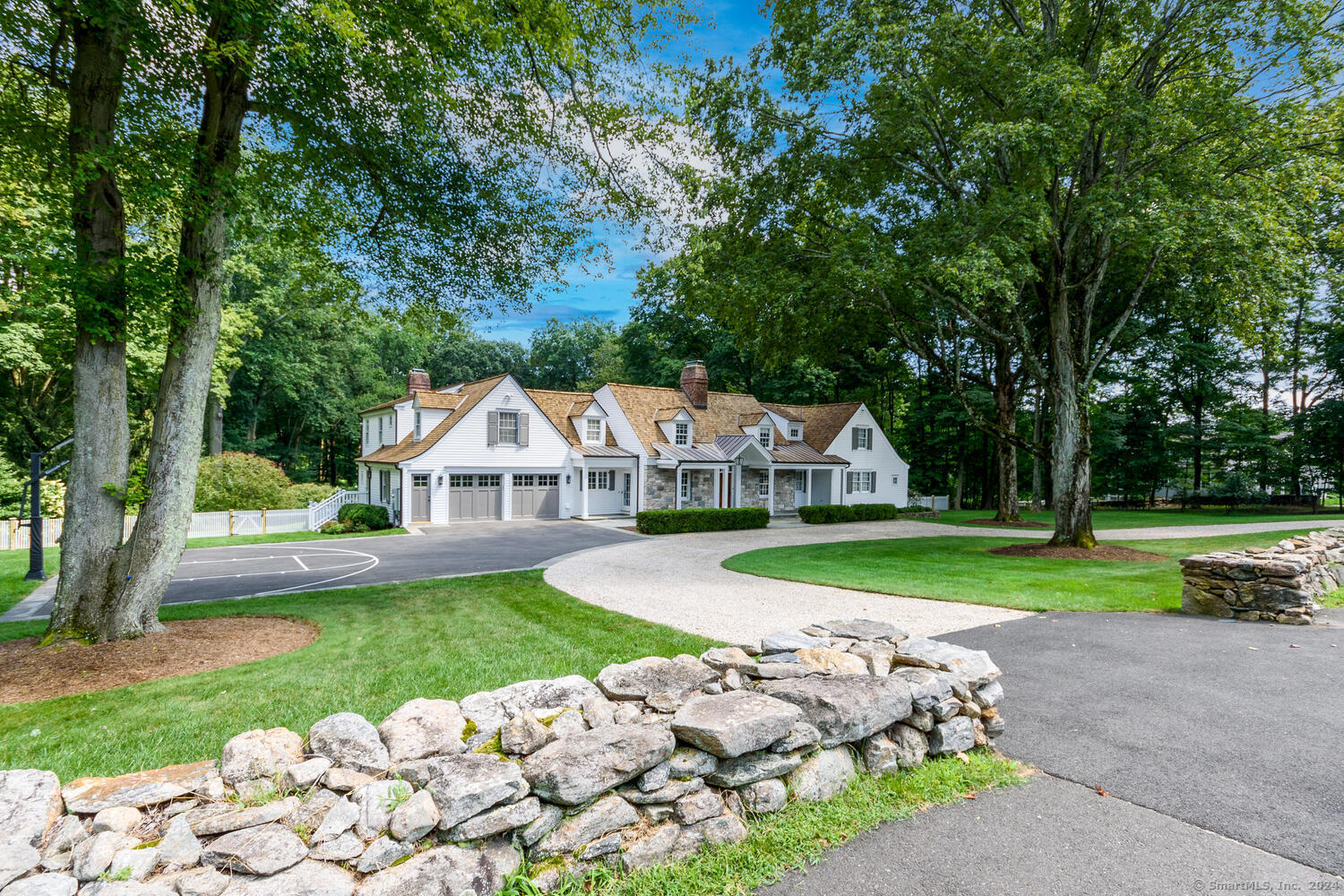 384 Hollow Tree Ridge Road Darien, CT 06820 - Photo 1 of 1 a front view of a house with garden