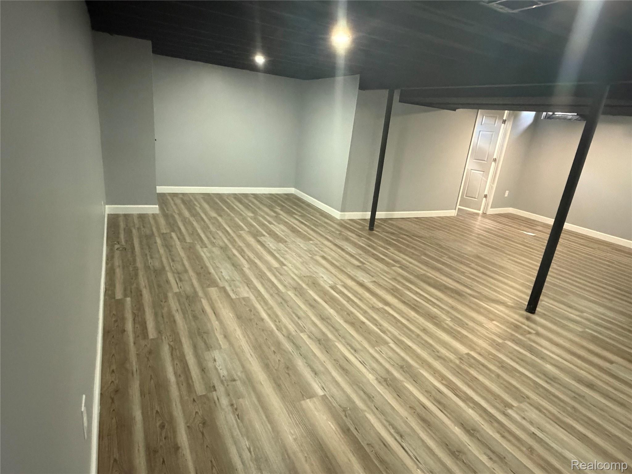 20698 Coachwood Road Riverview, MI 48193 - Photo 15 of 37 Finished below grade area featuring baseboards and light wood-style floors
