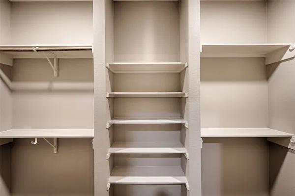 a view of an empty walk in closet