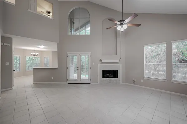 a view of livingroom with furniture chandelier fan and fireplace