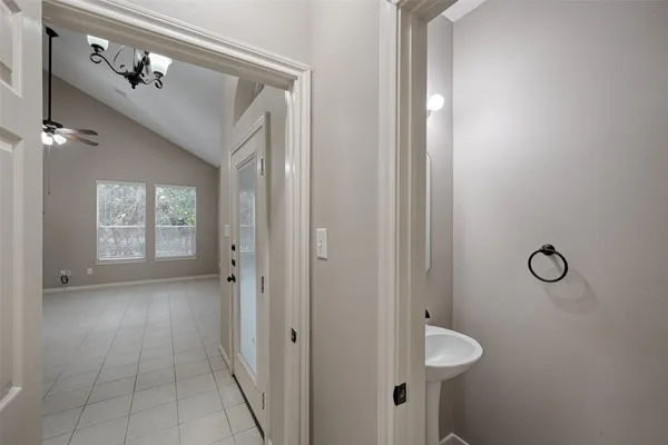 a bathroom with a toilet sink and shower