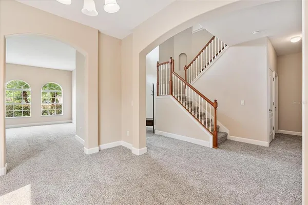 a view of a kitchen with a sink and stainless steel appliances