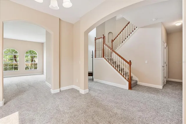 a view of a kitchen with a sink and stainless steel appliances