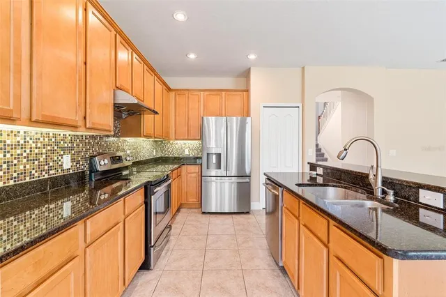a view of a bathroom with a sink and a mirror