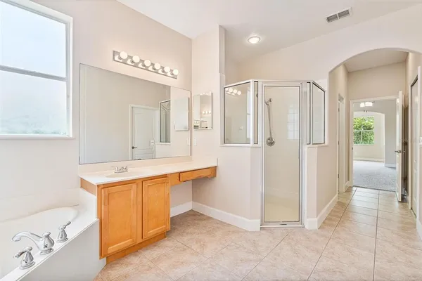 an aerial view of a house with a swimming pool yard and outdoor seating