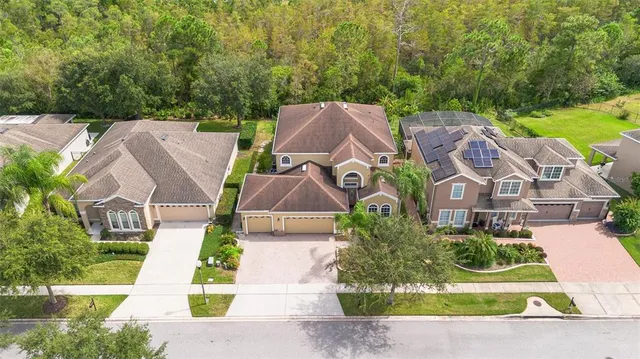 an aerial view of a house with a garden and plants