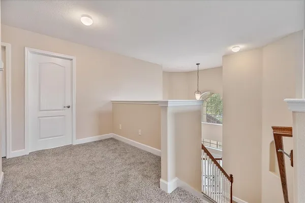 an aerial view of a house with a lake view