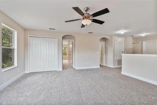 a room with furniture pool table and flat screen tv