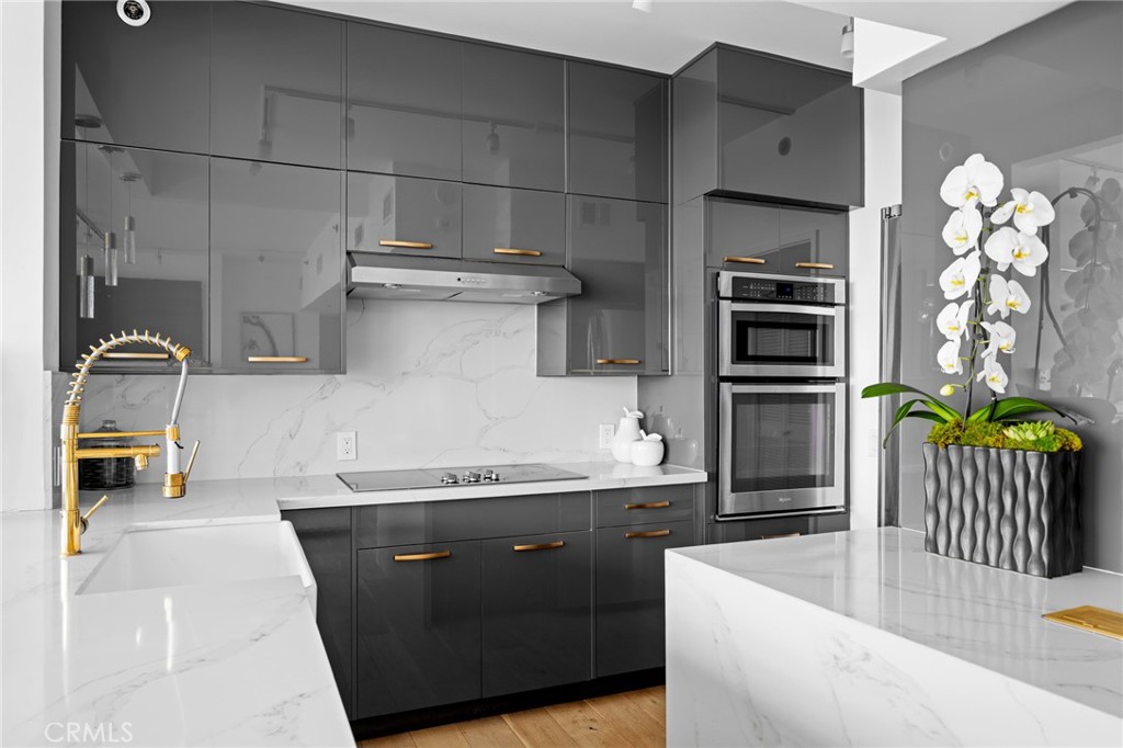 222 Monterey Road, Unit 1603 Glendale, CA 91206 - Photo 19 of 65 a kitchen with stainless steel appliances granite countertop a sink a stove and a refrigerator
