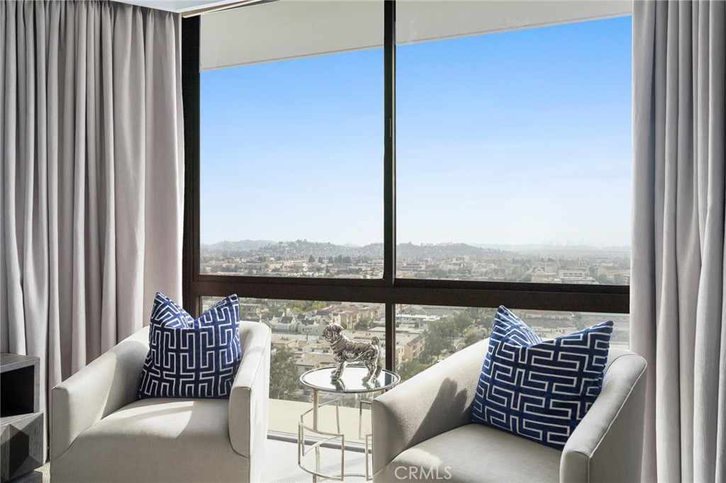 222 Monterey Road, Unit 1603 Glendale, CA 91206 - Photo 24 of 65 a view of a balcony with couches and wooden floor