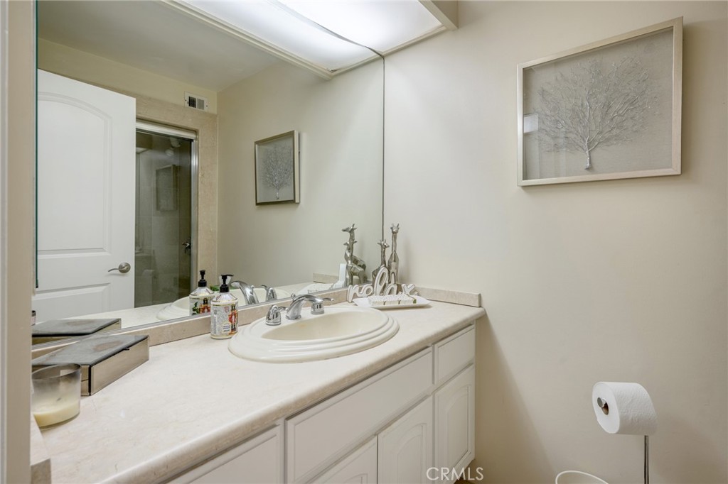 222 Monterey Road, Unit 1603 Glendale, CA 91206 - Photo 31 of 65 a bathroom with a sink and a mirror