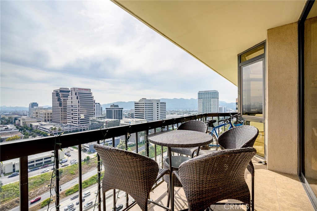 222 Monterey Road, Unit 1603 Glendale, CA 91206 - Photo 33 of 65 a dining room with furniture and a floor to ceiling window