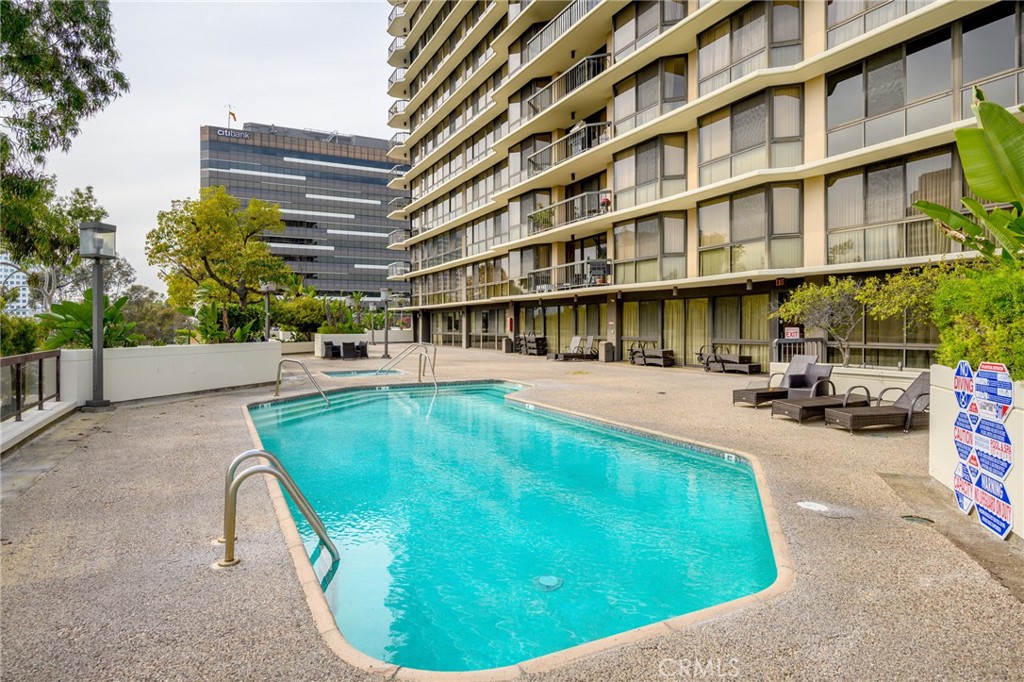 222 Monterey Road, Unit 1603 Glendale, CA 91206 - Photo 38 of 65 a view of a swimming pool with a lounge chairs