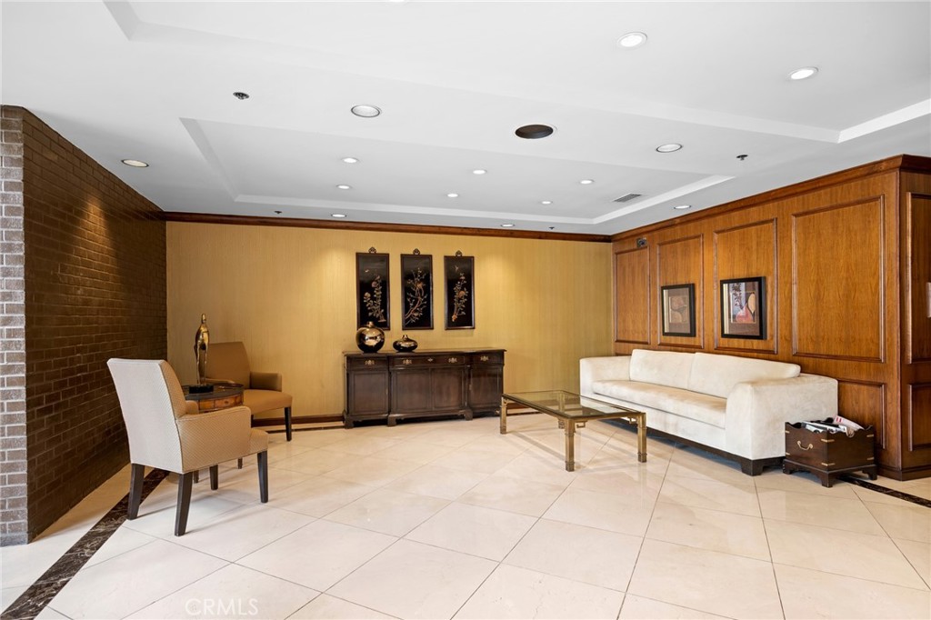 222 Monterey Road, Unit 1603 Glendale, CA 91206 - Photo 44 of 65 a living room with furniture and a flat screen tv