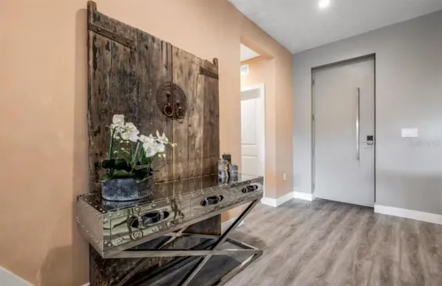 a room with furniture and wooden floor