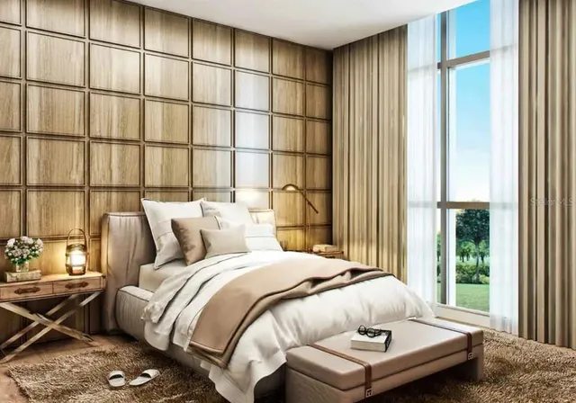 a bedroom with a bed and a window with outer view