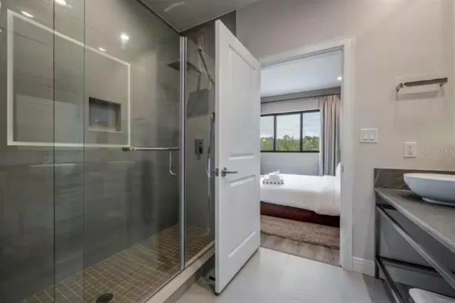 a bathroom with a tub and shower