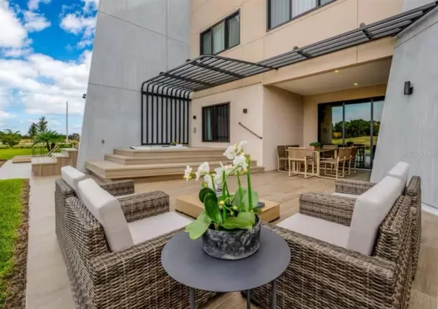 a view of a patio with couches table and chairs