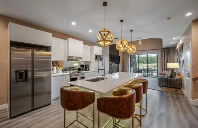 a kitchen with counter top space and stainless steel appliances