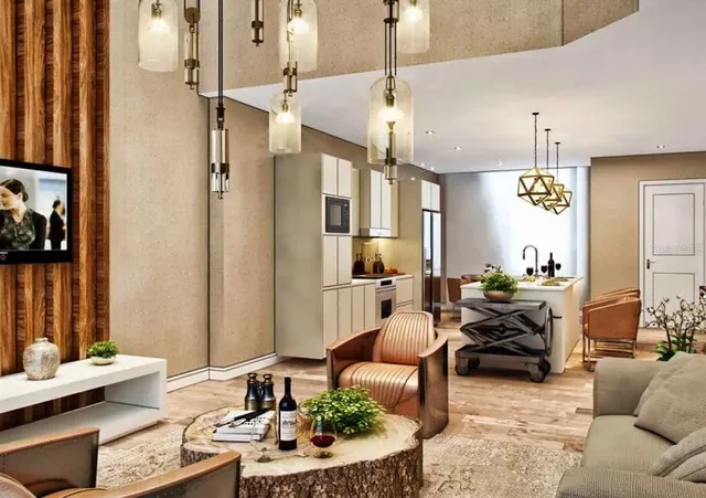 a living room with furniture and a chandelier