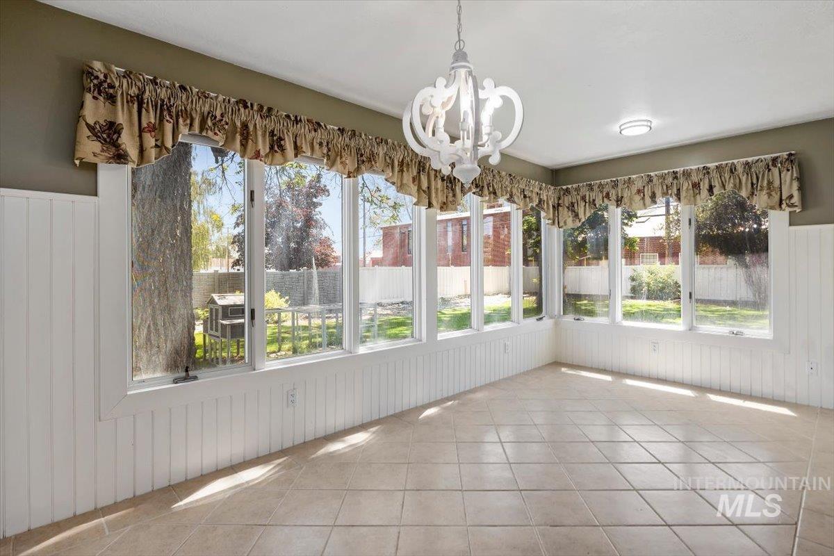 813 7th Street Rupert, ID 83350 - Photo 24 of 48 Room with extensive windows and white vertical paneling