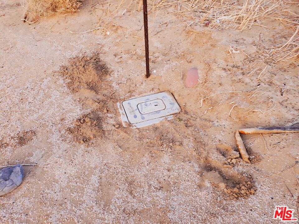 7797 Quartz Road Mojave, CA 93501 - Photo 9 of 23 a view of a refrigerator in a room