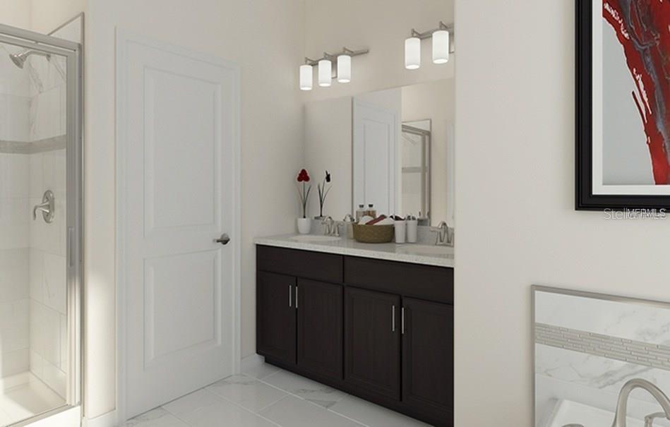 9020 Azalea Sands Lane Davenport, FL 33896 - Photo 5 of 16 a bathroom with a double vanity sink and a mirror