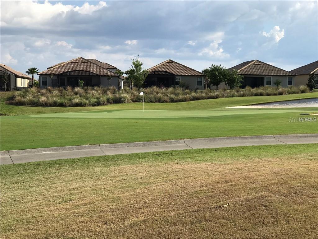 9020 Azalea Sands Lane Davenport, FL 33896 - Photo 10 of 16 a front view of house with yard and outdoor seating