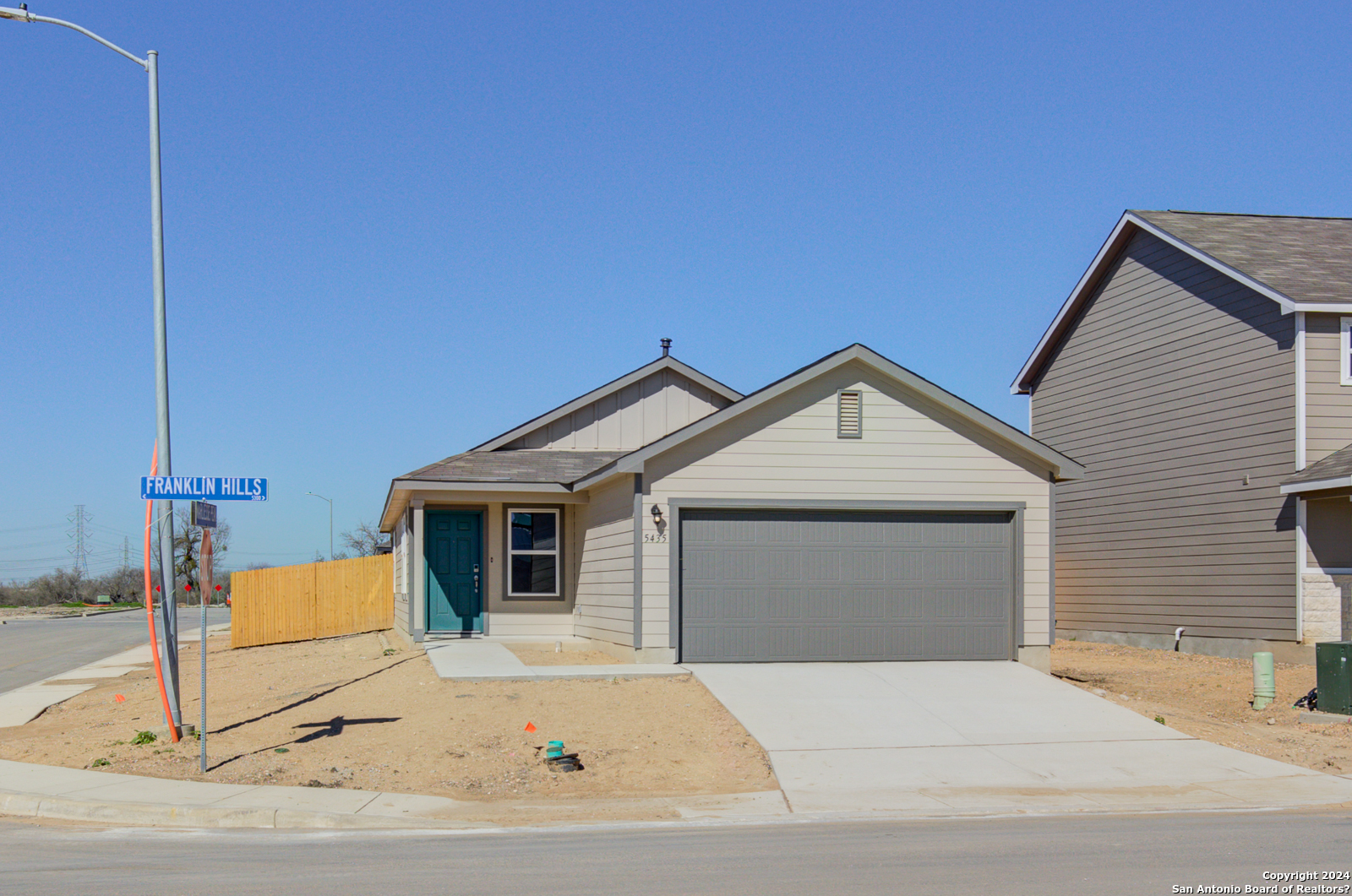 a front view of a house with garage