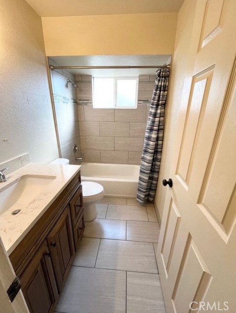 3056 Bedford Drive Merced, CA 95340 - Photo 13 of 19 a bathroom with a granite countertop sink toilet and shower