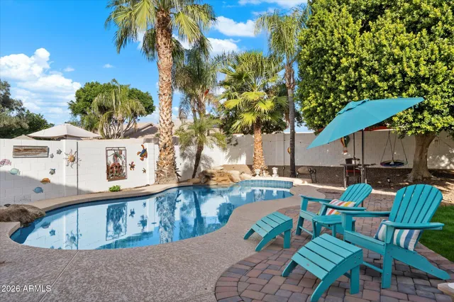 swimming pool with outdoor seating
