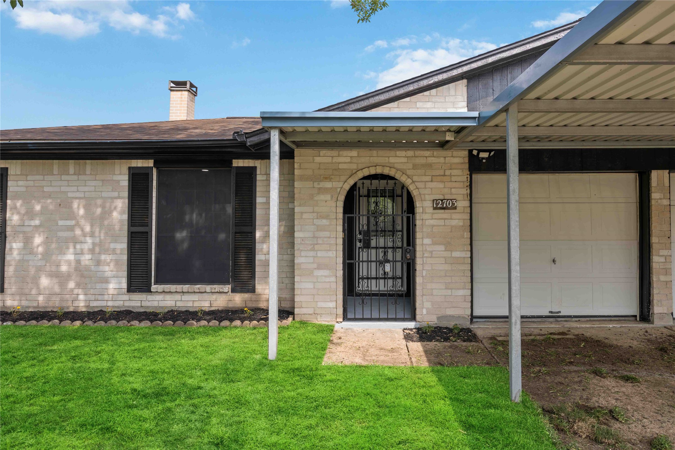 12703 Redfern Drive Houston, TX 77048 - Photo 27 of 28 Welcoming front entry with classic brick exterior and covered approach—blending timeless design with an inviting space ready for your personal touch.