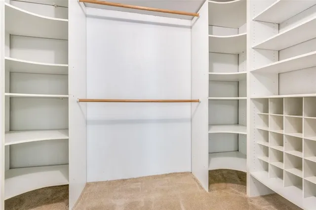 a view of an empty walk in closet