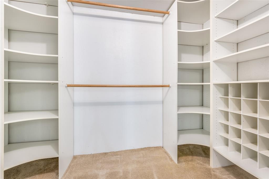 909 Coffield Street Bowie, TX 76230 - Photo 22 of 25 a view of an empty walk in closet