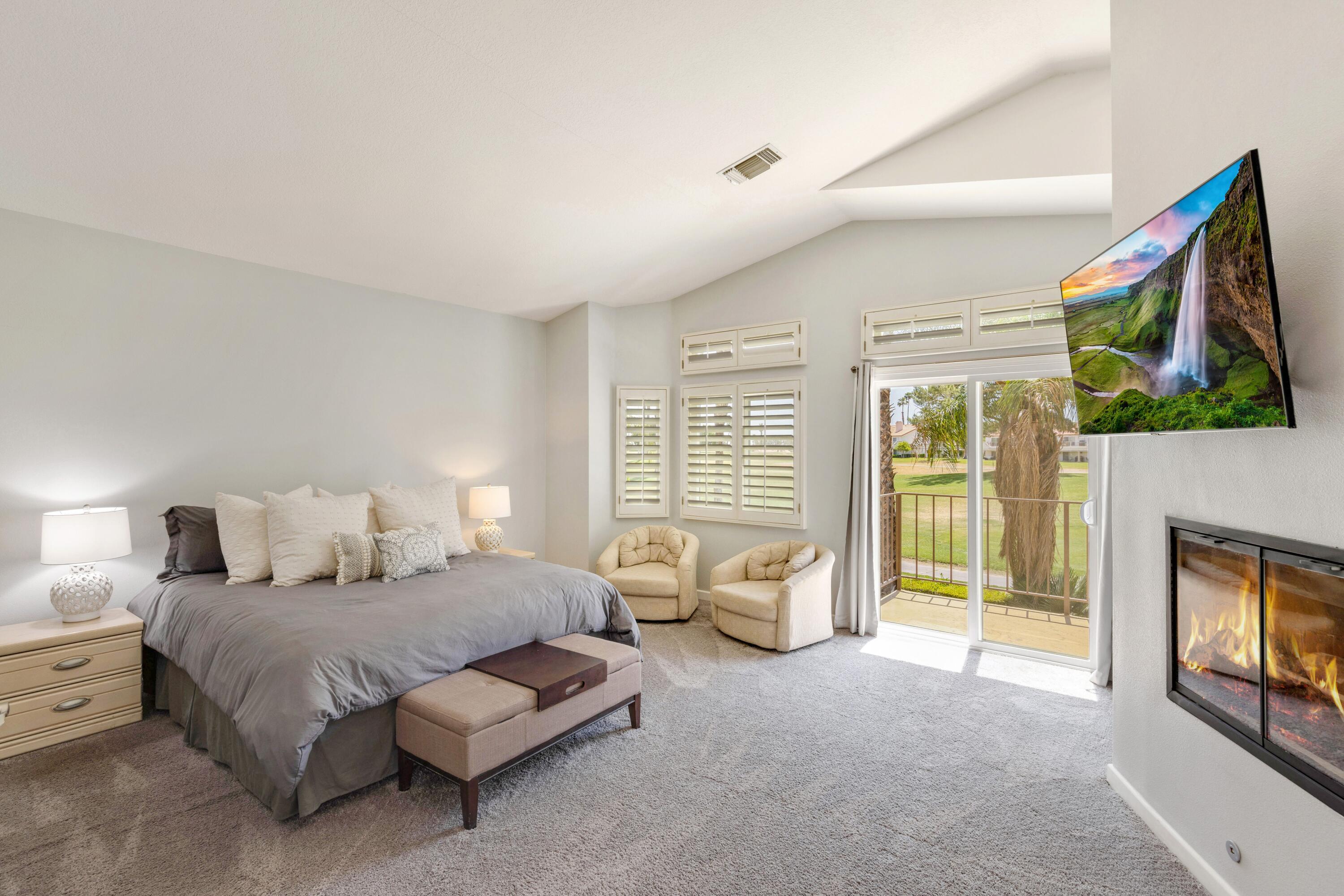 351 Augusta Drive Palm Desert, CA 92211 - Photo 12 of 26 a living room with furniture large window and flat screen tv