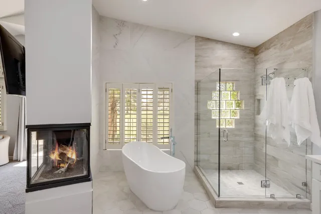 a bathroom with a toilet a sink and bathtub