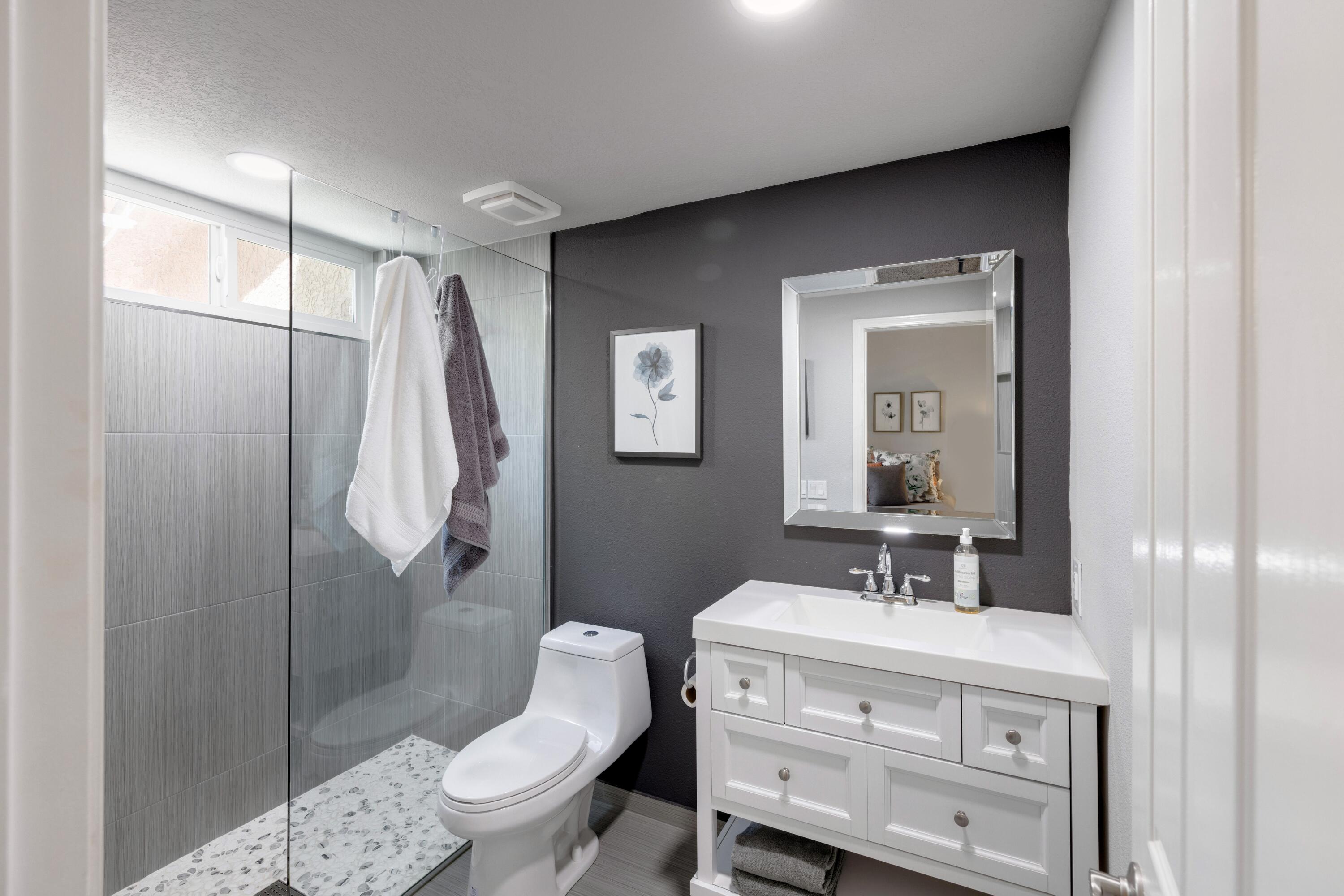 351 Augusta Drive Palm Desert, CA 92211 - Photo 19 of 26 a bathroom with a sink a toilet and shower