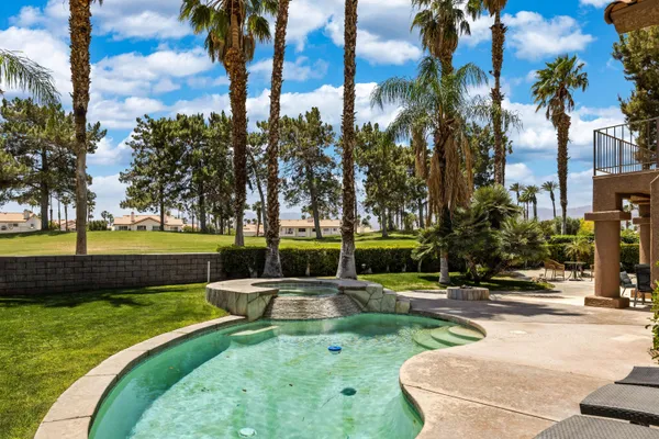 a view of a swimming pool with a patio