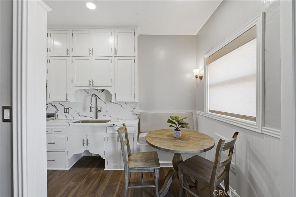 1030 East Ocean Boulevard, Unit 509 Long Beach, CA 90802 - Photo 15 of 39 a view of a dining room with furniture and wooden floor