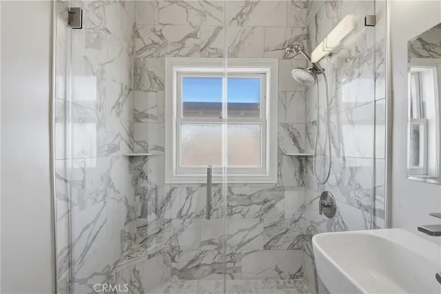 a bathroom with a bathtub and shower