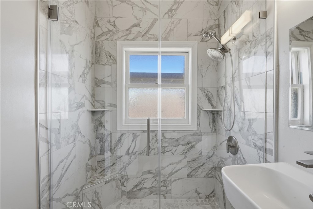 1030 East Ocean Boulevard, Unit 509 Long Beach, CA 90802 - Photo 19 of 39 a bathroom with a bathtub and shower