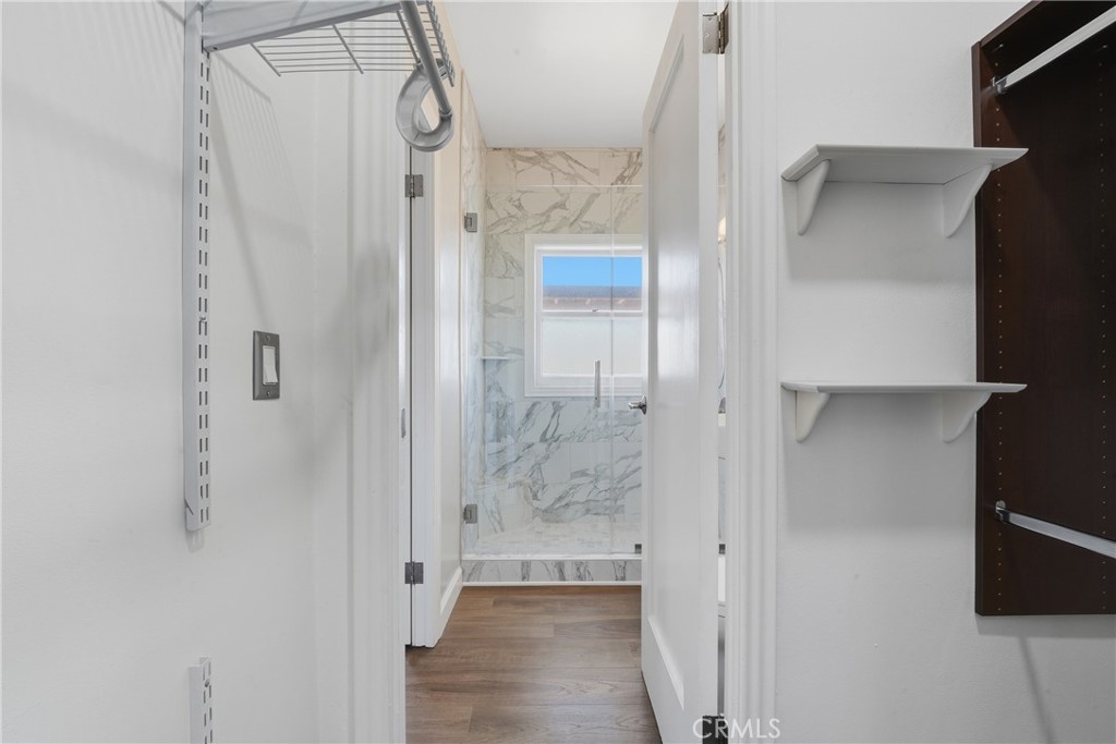 1030 East Ocean Boulevard, Unit 509 Long Beach, CA 90802 - Photo 21 of 39 a bathroom with a glass shower door