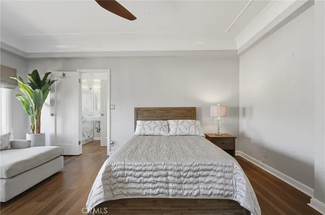 a bedroom with a large bed and a couch