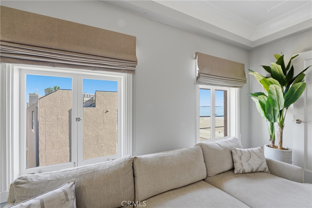 1030 East Ocean Boulevard, Unit 509 Long Beach, CA 90802 - Photo 8 of 39 a living room with furniture and a potted plant