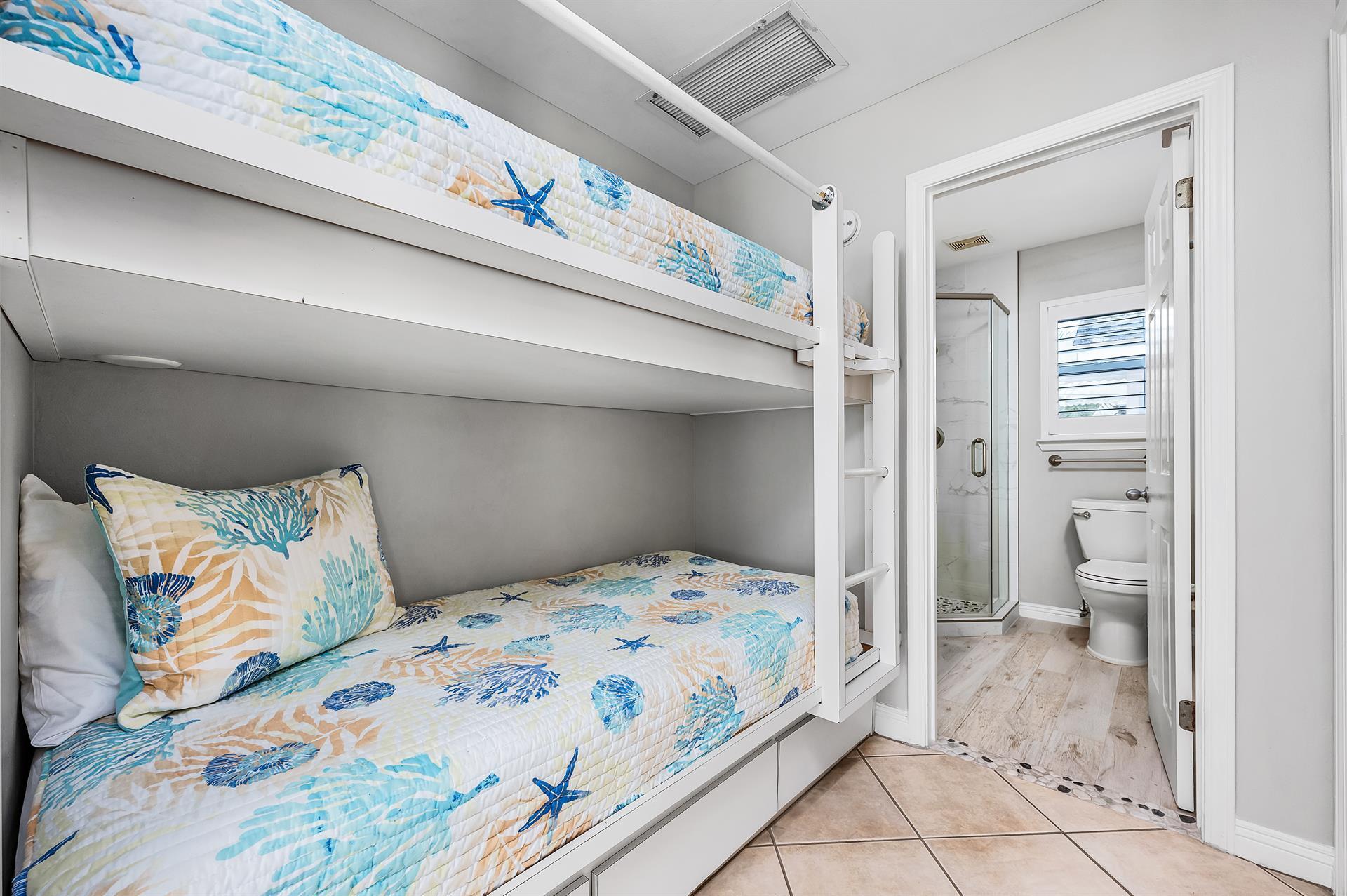 69 Crystal Beach Drive, Unit 8 Destin, FL 32541 - Photo 14 of 51 a bedroom with a bed and a painting on the wall