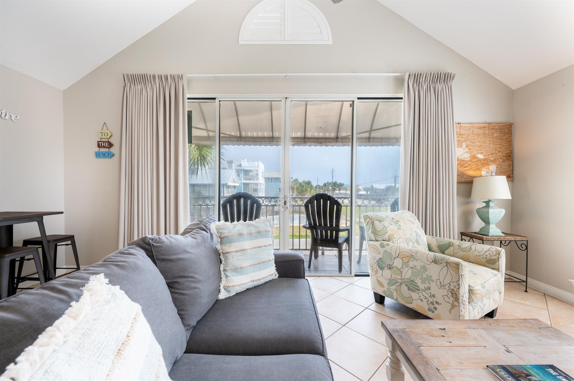 69 Crystal Beach Drive, Unit 8 Destin, FL 32541 - Photo 18 of 51 a living room with furniture and a large window