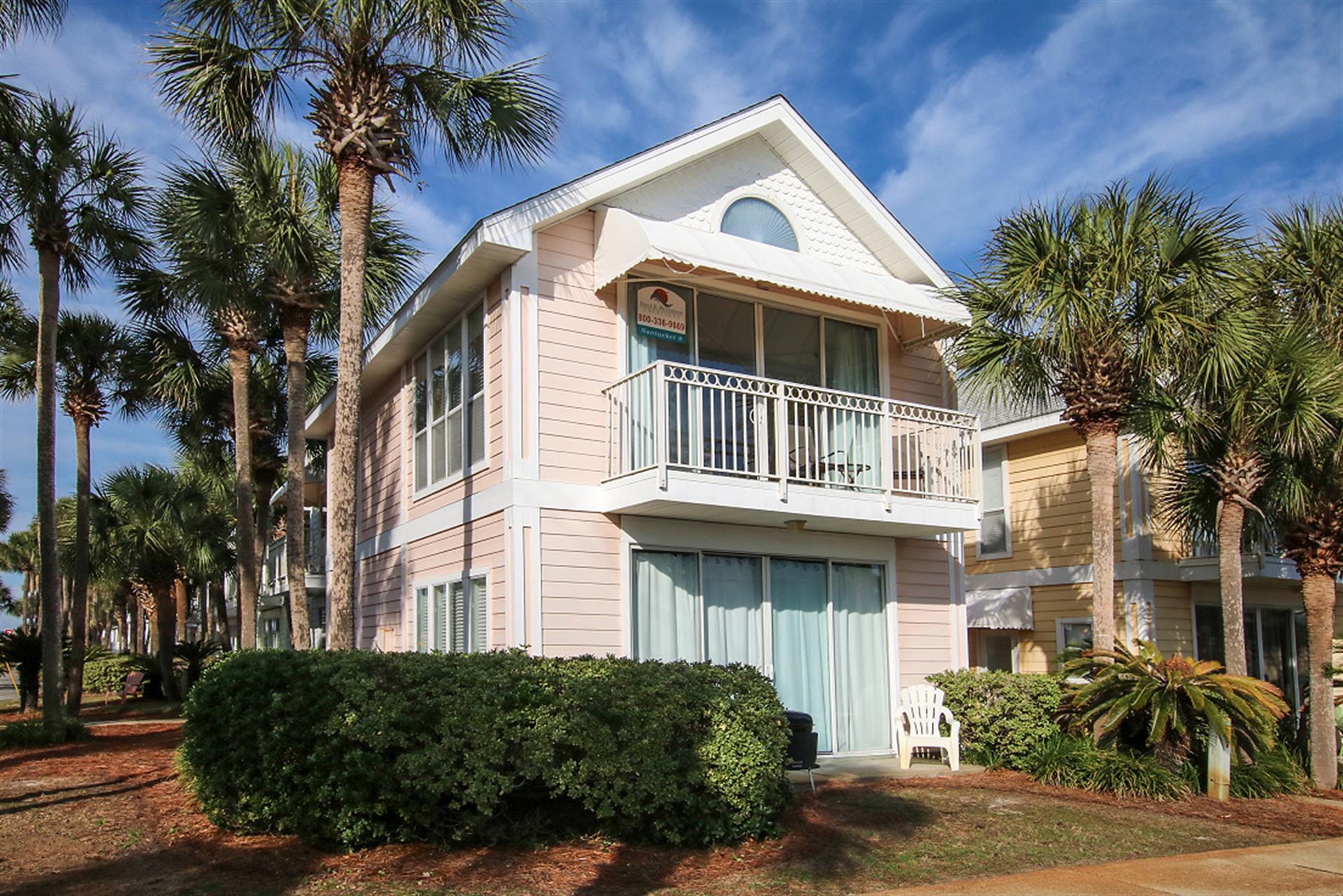 69 Crystal Beach Drive, Unit 8 Destin, FL 32541 - Photo 2 of 51 a front view of a house with a yard