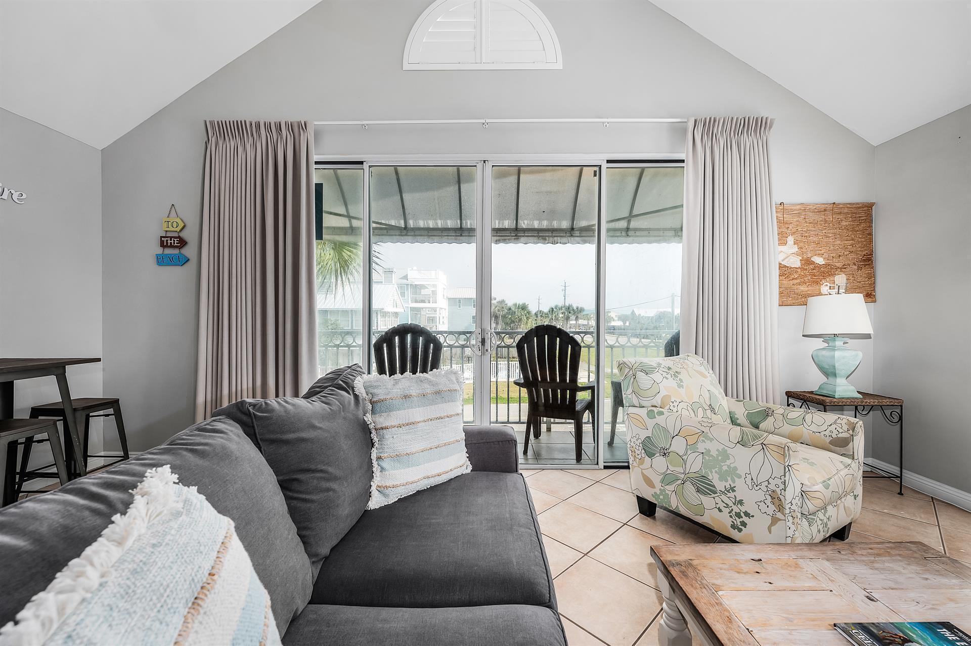 69 Crystal Beach Drive, Unit 8 Destin, FL 32541 - Photo 21 of 51 a living room with furniture and a large window