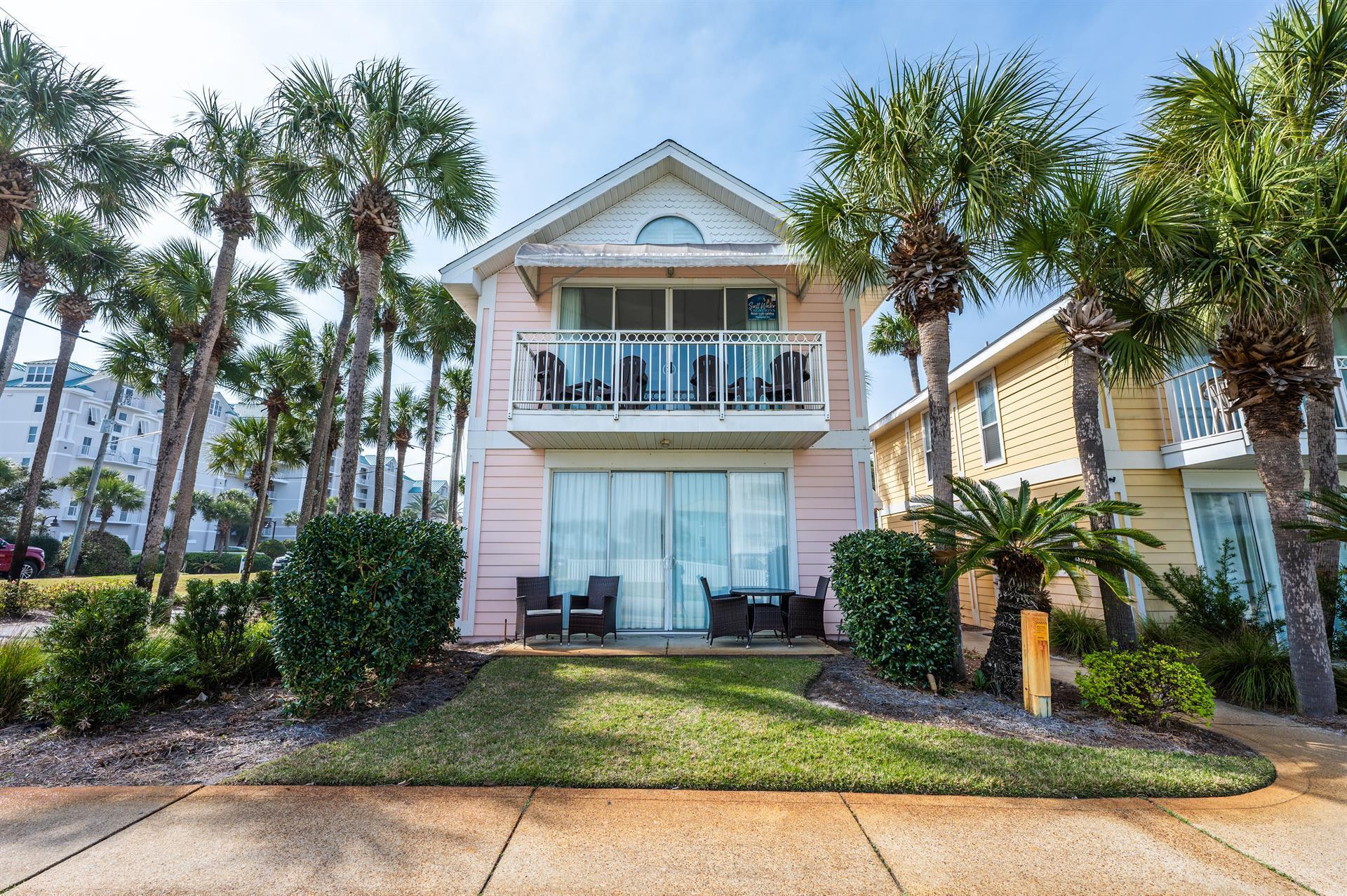 69 Crystal Beach Drive, Unit 8 Destin, FL 32541 - Photo 3 of 51 a front view of house with yard and green space